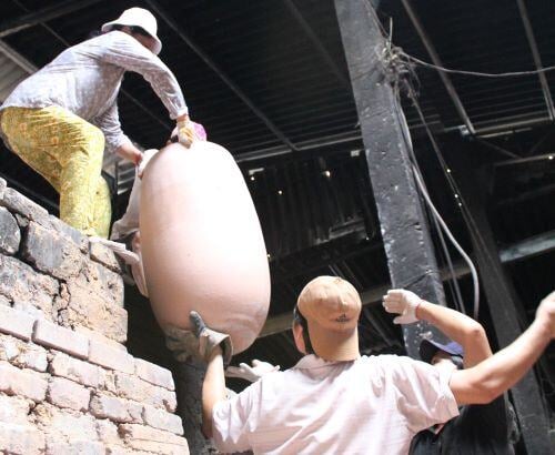 Pot leaving Kiln